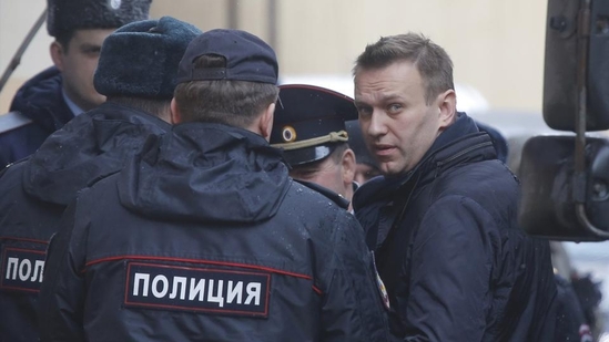 Russian opposition leader Alexei Navalny is escorted upon his arrival for a hearing in Moscow after being detained at a protest against corruption and demanding the resignation of Prime Minister Dmitry Medvedev.(Reuters) Russian opposition leader Alexei Navalny is escorted upon his arrival for a hearing in Moscow after being detained at a protest against corruption and demanding the resignation of Prime Minister Dmitry Medvedev.(Reuters)