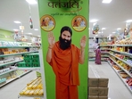 A hoarding with an image of Baba Ramdev inside a Patanjali store in Ahmedabad. (Reuters) A hoarding with an image of Baba Ramdev inside a Patanjali store in Ahmedabad. (Reuters)