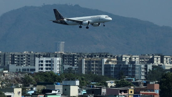 Vistara Flight Disruptions: A Vistara passenger aircraft lands at the Chhatrapati Shivaji International airport in Mumbai, India. The airline, which operates more than 300 flights daily, has cut 20-25 daily flights, Vistara CEO said.(Reuters)