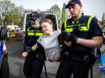 Police detain Swedish climate activist Greta Thunberg (C) during a climate march against fossil subsidies near the highway A12 in the Hague, on April 6, 2024. (AFP) Police detain Swedish climate activist Greta Thunberg (C) during a climate march against fossil subsidies near the highway A12 in the Hague, on April 6, 2024. (AFP)