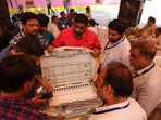 Election staff scans serial numbers of Electronic Voting Machines (EVMs) before dispatching them from a warehouse in Ahmedabad.(Amit Dave / Reuters) Election staff scans serial numbers of Electronic Voting Machines (EVMs) before dispatching them from a warehouse in Ahmedabad.(Amit Dave / Reuters)