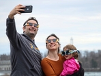 A family poses for a selfie during a total solar eclipse at Niagara Falls, New York, U.S.(REUTERS)