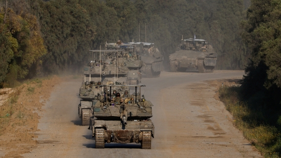 Israeli tanks and armoured personnel carriers (APC) manoeuvre on their way to Gaza, amid the ongoing conflict between Israel and the Palestinian Islamist group Hamas, near the Israel-Gaza border, in Israel, April 10, 2024. (REUTERS)