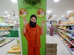A hoarding with an image of Baba Ramdev inside a Patanjali store in Ahmedabad. (Reuters) A hoarding with an image of Baba Ramdev inside a Patanjali store in Ahmedabad. (Reuters)