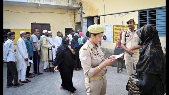 Voters seen standing in queue to cast their votes in the first phase of Lok Sabha elections 2024 at a polling station in Muzaffarnagar, on Friday. (Ajay Aggarwal/ HT Photo) Voters seen standing in queue to cast their votes in the first phase of Lok Sabha elections 2024 at a polling station in Muzaffarnagar, on Friday. (Ajay Aggarwal/ HT Photo)