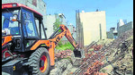MC officials demolishing illegal buildings at Jassian road in Ludhiana on Monday. (HT Photo) MC officials demolishing illegal buildings at Jassian road in Ludhiana on Monday. (HT Photo)