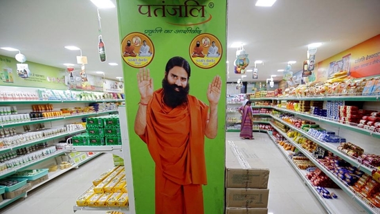 Patanjali ads case: A hoarding with an image of Baba Ramdev inside a Patanjali store in Ahmedabad. The Supreme Court was considering a contempt case against Patanjali Ayurved, Balkrishna and Ramdev for publishing misleading medical advertisements.(Reuters) Patanjali ads case: A hoarding with an image of Baba Ramdev inside a Patanjali store in Ahmedabad. The Supreme Court was considering a contempt case against Patanjali Ayurved, Balkrishna and Ramdev for publishing misleading medical advertisements.(Reuters)