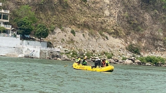 SDRF team searching for two tourists who were washed away in Ganga in Rishikesh on Sunday. SDRF team searching for two tourists who were washed away in Ganga in Rishikesh on Sunday.