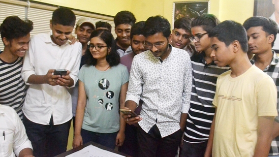 Lohia Nagar Mount Carmel School, Patna students checking ICSE, ISC Result 2024 on mobile. (Santosh Kumar /HT Photographer )