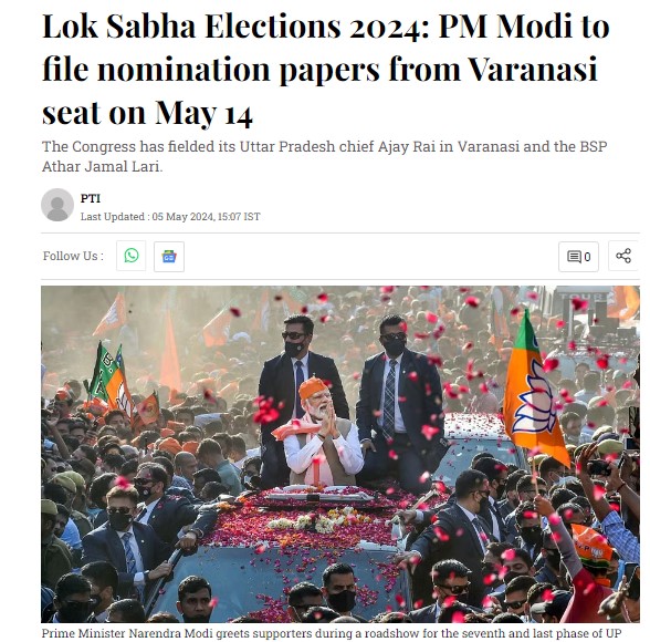 PM Modi greets supporters during a roadshow. PM Modi greets supporters during a roadshow.