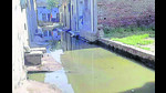 Sewage overflow coming out on a street of Dhandari Khurd area in Ludhiana on Tuesday. (HT photo) Sewage overflow coming out on a street of Dhandari Khurd area in Ludhiana on Tuesday. (HT photo)