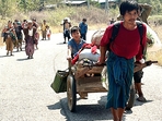 In this photo released by the Free Burma Rangers, people flee Myanmar military in Pasaung, Karenni state, Myanmar on March 1, 2024.- Representative Image (Free Burma Rangers via AP)(AP) In this photo released by the Free Burma Rangers, people flee Myanmar military in Pasaung, Karenni state, Myanmar on March 1, 2024.- Representative Image (Free Burma Rangers via AP)(AP)