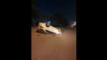 A white Honda City car lost control and rammed into concrete drainage. It then flipped multiple times and came to a halt on its roof in the middle of the road trapping the driver inside, on the Bhangrola-Pataudi road near Bhangrola in Manesar. (HT PHOTO.) A white Honda City car lost control and rammed into concrete drainage. It then flipped multiple times and came to a halt on its roof in the middle of the road trapping the driver inside, on the Bhangrola-Pataudi road near Bhangrola in Manesar. (HT PHOTO.)