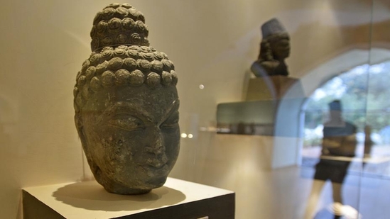 A sculpture of the head of Gautam Buddha, the founder of Buddhism, on display at the gallery. The gallery is curated by the Archaeological Survey of India (ASI). Most of the objects retrieved are through the ministry of external affairs and other law enforcement agencies and are stored at the ASI’s central antiquity collection (CAC) or other authorities. (Biplov Bhuyan / HT Photo) A sculpture of the head of Gautam Buddha, the founder of Buddhism, on display at the gallery. The gallery is curated by the Archaeological Survey of India (ASI). Most of the objects retrieved are through the ministry of external affairs and other law enforcement agencies and are stored at the ASI’s central antiquity collection (CAC) or other authorities. (Biplov Bhuyan / HT Photo)
