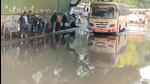 Commuters wait for bus at waterlogged Swargate ST depot on Sunday. They face the situation even before monsoon. (HT) Commuters wait for bus at waterlogged Swargate ST depot on Sunday. They face the situation even before monsoon. (HT)