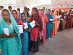 Voters show their identity cards as they wait in a queue at a polling station to cast their votes during the sixth phase of the Lok Sabha elections.(PTI) Voters show their identity cards as they wait in a queue at a polling station to cast their votes during the sixth phase of the Lok Sabha elections.(PTI)