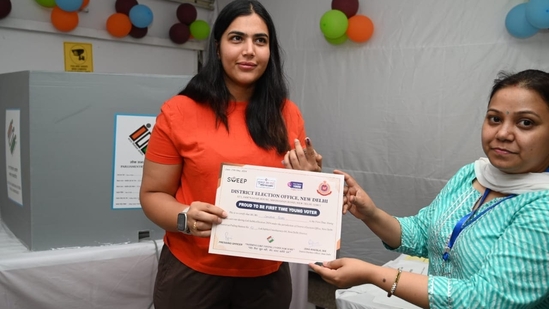 Sanjana, a first-time voter, after casting her vote taking a certificate at Nirman Bhawan in New Delhi on Saturday. (Arvind Yadav/HT) Sanjana, a first-time voter, after casting her vote taking a certificate at Nirman Bhawan in New Delhi on Saturday. (Arvind Yadav/HT)