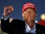 CONCORD, NORTH CAROLINA - MAY 26: Former U.S. President and Republican presidential candidate Donald Trump raises his fist as he looks on during the NASCAR Cup Series Coca-Cola 600 at Charlotte Motor Speedway on May 26, 2024 in Concord, North Carolina. Jared C. Tilton/Getty Images/AFP (Photo by Jared C. Tilton / GETTY IMAGES NORTH AMERICA / Getty Images via AFP)(Getty Images via AFP) CONCORD, NORTH CAROLINA - MAY 26: Former U.S. President and Republican presidential candidate Donald Trump raises his fist as he looks on during the NASCAR Cup Series Coca-Cola 600 at Charlotte Motor Speedway on May 26, 2024 in Concord, North Carolina. Jared C. Tilton/Getty Images/AFP (Photo by Jared C. Tilton / GETTY IMAGES NORTH AMERICA / Getty Images via AFP)(Getty Images via AFP)