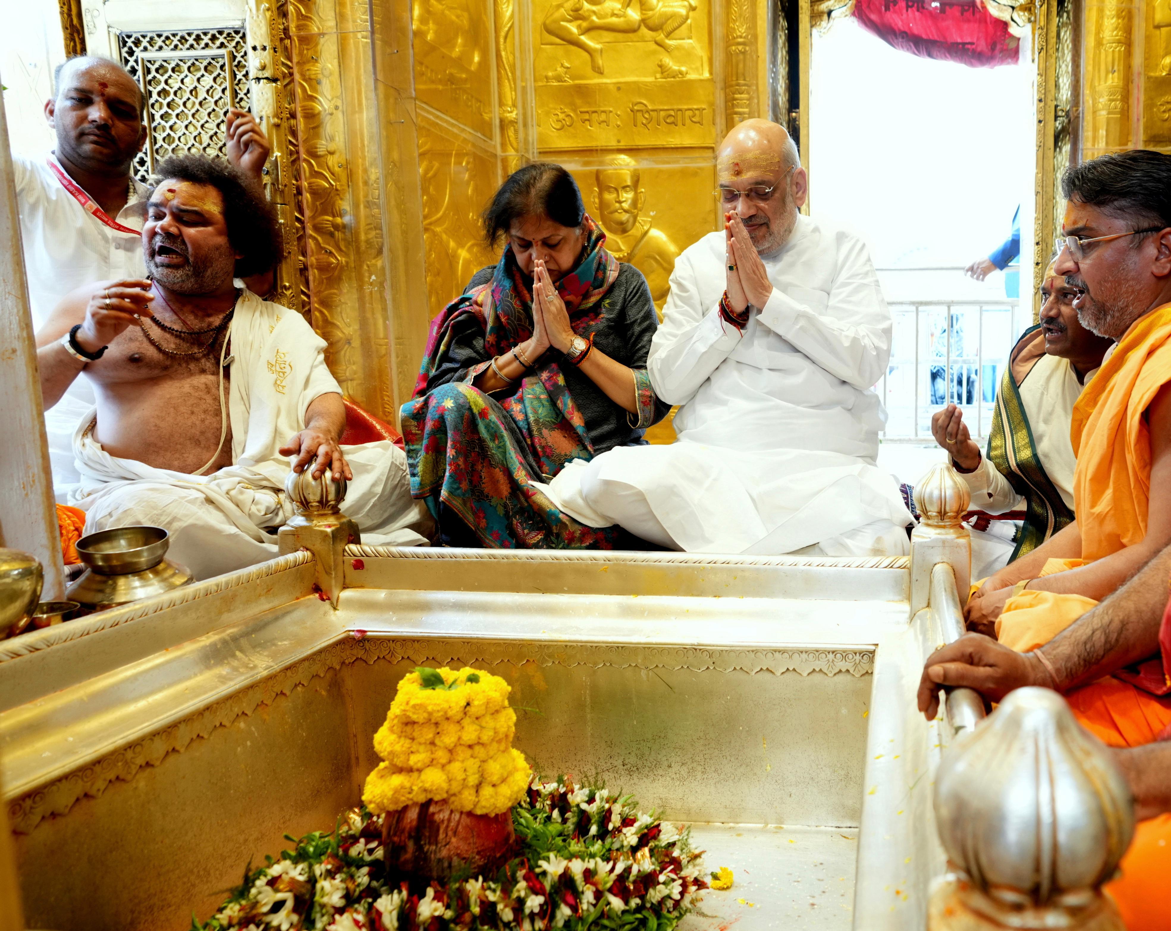Home minister Amit shah with wife Sonal Shah at Kashi Vishwanath Temple. Home minister Amit shah with wife Sonal Shah at Kashi Vishwanath Temple.