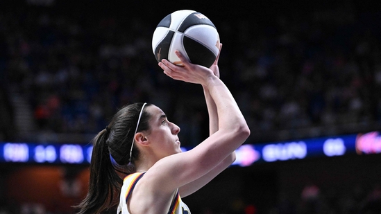 Caitlin Clark #22 of the Indiana Fever attempts a three point basket against the Connecticut Sun during the second half at the Mohegan Sun Arena on June 10, 2024 in Uncasville, (Photo by Brian Fluharty / GETTY IMAGES NORTH AMERICA / Getty Images via AFP)(Getty Images via AFP) Caitlin Clark #22 of the Indiana Fever attempts a three point basket against the Connecticut Sun during the second half at the Mohegan Sun Arena on June 10, 2024 in Uncasville, (Photo by Brian Fluharty / GETTY IMAGES NORTH AMERICA / Getty Images via AFP)(Getty Images via AFP)