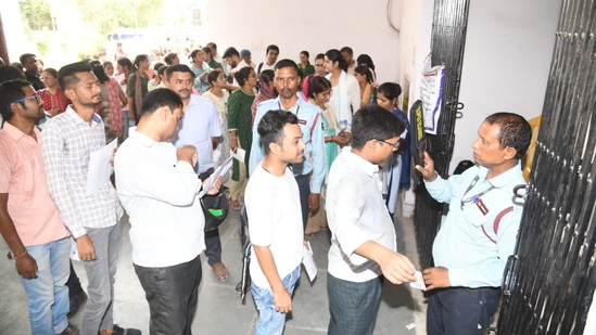 Candidates wait to complete the frisking procedure before entering the exam hall to appear for UGC NET Exam 2024 in Patna.(Santosh Kumar) Candidates wait to complete the frisking procedure before entering the exam hall to appear for UGC NET Exam 2024 in Patna.(Santosh Kumar)