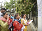 Aspirants search their roll numbers for seats before entering an examination center to appear in the UGC-NET exam.(PTI) Aspirants search their roll numbers for seats before entering an examination center to appear in the UGC-NET exam.(PTI)