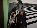 Sandi Pei (R), son of renowned Chinese-American architect I.M. Pei, is photographed in front of a photo of his father after a media preview of Sandi Pei (R), son of renowned Chinese-American architect I.M. Pei, is photographed in front of a photo of his father after a media preview of