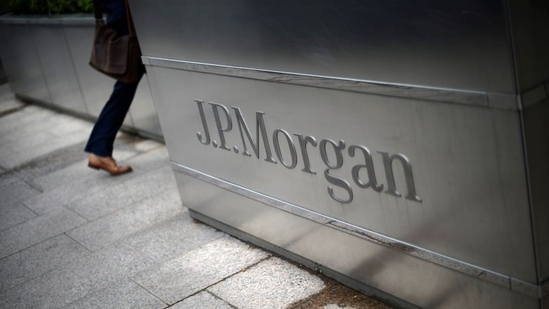 A man walks into the J.P. Morgan headquarters at Canary Wharf in London (Reuters)