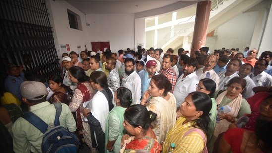 <p>Candidates wait to complete the security check and enter the exam hall to attempt the  BPSC Headmaster exam in Patna on Friday.</p>(Santosh Kumar)