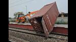 A JCB removing one of the containers that fell off a goods train rake at Taraori station in Karnal district on Tuesday, affecting traffic on the Ambala-Delhi route. (HT Photo) A JCB removing one of the containers that fell off a goods train rake at Taraori station in Karnal district on Tuesday, affecting traffic on the Ambala-Delhi route. (HT Photo)