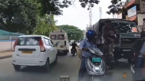 Bengaluru army officer schools motorist for driving in the wrong direction on a busy road. Video Bengaluru army officer schools motorist for driving in the wrong direction on a busy road. Video