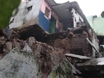 Due to the landslide in Vijayawada, heavy stones from the hillock crashed on the houses on Saturday. (HT Photo) Due to the landslide in Vijayawada, heavy stones from the hillock crashed on the houses on Saturday. (HT Photo)