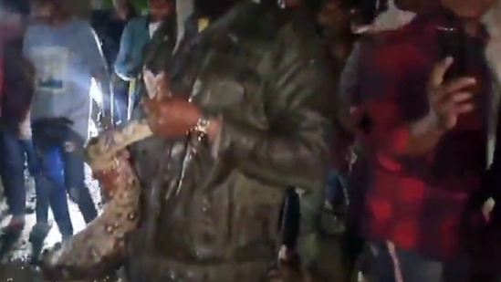 Massive python rescued in Hyderabad amid heavy rain, people compete to click pictures of snake. Watch Massive python rescued in Hyderabad amid heavy rain, people compete to click pictures of snake. Watch