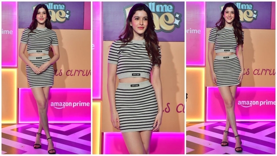 Shanaya Kapoor kept it simple yet chic in a striped black and grey top, paired with a matching mini skirt for a coordinated look. She finished off the outfit with black stiletto heels and soft blush-toned makeup, looking effortlessly stylish.(HT Photo/VarinderChawla)