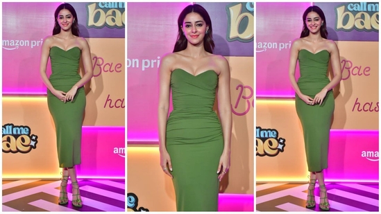 Ananya Panday wowed in a green strapless Alex Perry dress with an off-shoulder neckline and bodycon fit. She paired it with matching Jimmy Choo sandals, glam makeup, and loose waves for a stunning look.(HT Photo/VarinderChawla)
