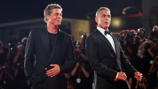 Brad Pitt and George Clooney pose on the red carpet during arrivals for the movie "Wolfs", presented out of competition, during the 81st Venice Film Festival in Venice, Italy, September 1, 2024.(REUTERS)