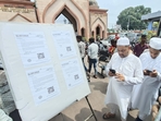People giving their input by scanning a QR code at the Aishbagh Eidgah, in Lucknow, on Friday. (HT Photo) People giving their input by scanning a QR code at the Aishbagh Eidgah, in Lucknow, on Friday. (HT Photo)