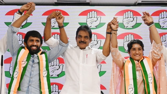 Olympian wrestlers Vinesh Phogat and Bajrang Punia with Congress leader KC Venugopal at the AICC headquarters in New Delhi on September 6.(HT photo/ Vipin Kumar) Olympian wrestlers Vinesh Phogat and Bajrang Punia with Congress leader KC Venugopal at the AICC headquarters in New Delhi on September 6.(HT photo/ Vipin Kumar)