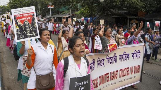Health workers and others take part in a protest rally over the alleged sexual assault and murder of a trainee doctor in Kolkata on Saturday. (PTI) Health workers and others take part in a protest rally over the alleged sexual assault and murder of a trainee doctor in Kolkata on Saturday. (PTI)