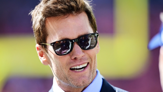 Sep 8, 2024; Cleveland, Ohio, USA; Fox Sports broadcaster Tom Brady talks on the field before the game between the Cleveland Browns and the Dallas Cowboys at Huntington Bank Field. Mandatory Credit: Ken Blaze-Imagn Images(USA TODAY Sports via Reuters Con)