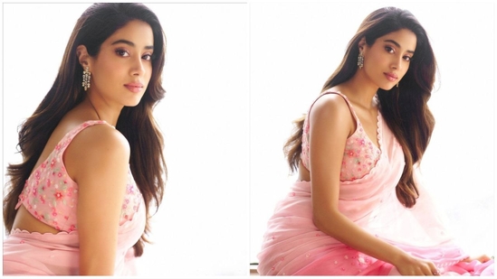 Janhvi paired her saree with a matching sleeveless blouse, embellished with floral details. Assisted by celebrity stylist Ami Patel, she completed her look with a pair of statement dangling diamond earrings.(Instagram/@janhvikapoor)