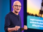 Microsoft's Satya Nadella urges leaders to reinvent themselves, focusing on optimism and soft skills to better manage employees. He stresses the need for clarity and engagement, pointing out a productivity paradox where managers perceive slacking, while employees feel overworked.(AFP) Microsoft's Satya Nadella urges leaders to reinvent themselves, focusing on optimism and soft skills to better manage employees. He stresses the need for clarity and engagement, pointing out a productivity paradox where managers perceive slacking, while employees feel overworked.(AFP)