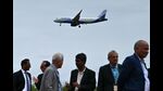 An Indigo aircraft prepares to land as Air India airline's employees gather during its groundbreaking ceremony of maintenance, repair, and overhaul (MRO) facility, at Kempegowda International Airport in Bengaluru on September 4, 2024. (Photo by Idrees MOHAMMED / AFP) (AFP) An Indigo aircraft prepares to land as Air India airline's employees gather during its groundbreaking ceremony of maintenance, repair, and overhaul (MRO) facility, at Kempegowda International Airport in Bengaluru on September 4, 2024. (Photo by Idrees MOHAMMED / AFP) (AFP)