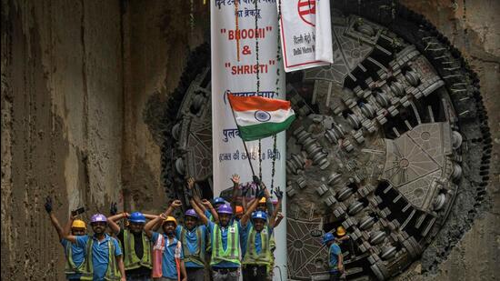 DMRC workers at the site of the twin break through on Wednesday. (ANI) DMRC workers at the site of the twin break through on Wednesday. (ANI)