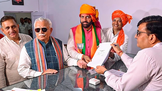 Kurukshetra: Haryana Chief Minister Nayab Saini who files his nomination papers for Haryana Assembly elections, as Union Minister Manohar Lal looks on, in Kurukshetra, Tuesday, Sept. 10, 2024. (PTI)