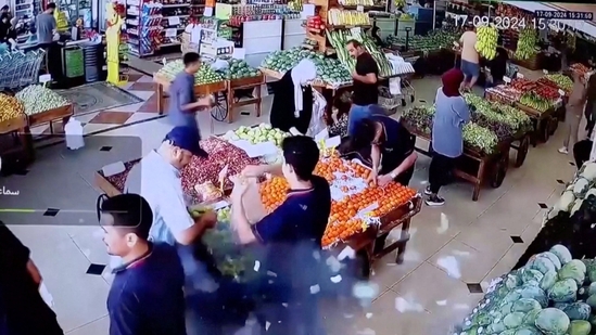 A man's bag explodes in a supermarket in Beirut, Lebanon, September 17, 2024 in this screen grab from a video obtained from social media.(via REUTERS)