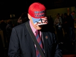 A delegate wearing a US-themed cap reading A delegate wearing a US-themed cap reading