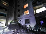 Emergency services workers look to move rubble and find injured after a Russian strike on a residential building in Kharkiv, Ukraine early Sunday Sept. 22, 2024. (Kharkiv Regional Military Administration via AP)(AP) Emergency services workers look to move rubble and find injured after a Russian strike on a residential building in Kharkiv, Ukraine early Sunday Sept. 22, 2024. (Kharkiv Regional Military Administration via AP)(AP)
