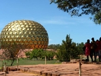 Visitors stand near the Matri Mandir, an edifice of spiritual significance for practitioners of integral yoga, in Auroville near Pondicherry on April 9, 2022. (Photo by Arun SANKAR / AFP) (AFP) Visitors stand near the Matri Mandir, an edifice of spiritual significance for practitioners of integral yoga, in Auroville near Pondicherry on April 9, 2022. (Photo by Arun SANKAR / AFP) (AFP)