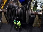 A worker inspects the offline turbine hall of Ratcliffe on Soar Coal-fired power station in Nottinghamshire central England on October 1, 2024. The UK�s last coal-fired power station shut down on September 30 after 60 years of looming over the small town of the same name, the closure signalled the end to polluting coal-powered electricity in the UK, in a landmark first for any G7 nation. (Photo by Darren Staples / AFP)(AFP) A worker inspects the offline turbine hall of Ratcliffe on Soar Coal-fired power station in Nottinghamshire central England on October 1, 2024. The UK�s last coal-fired power station shut down on September 30 after 60 years of looming over the small town of the same name, the closure signalled the end to polluting coal-powered electricity in the UK, in a landmark first for any G7 nation. (Photo by Darren Staples / AFP)(AFP)